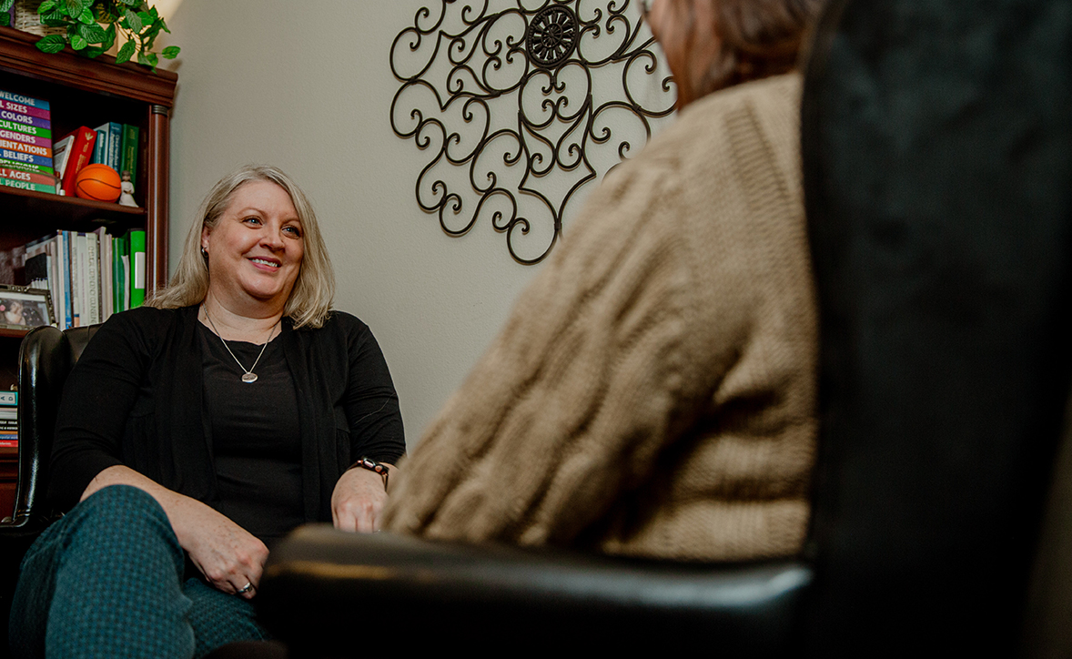 Provider sitting with patient in room